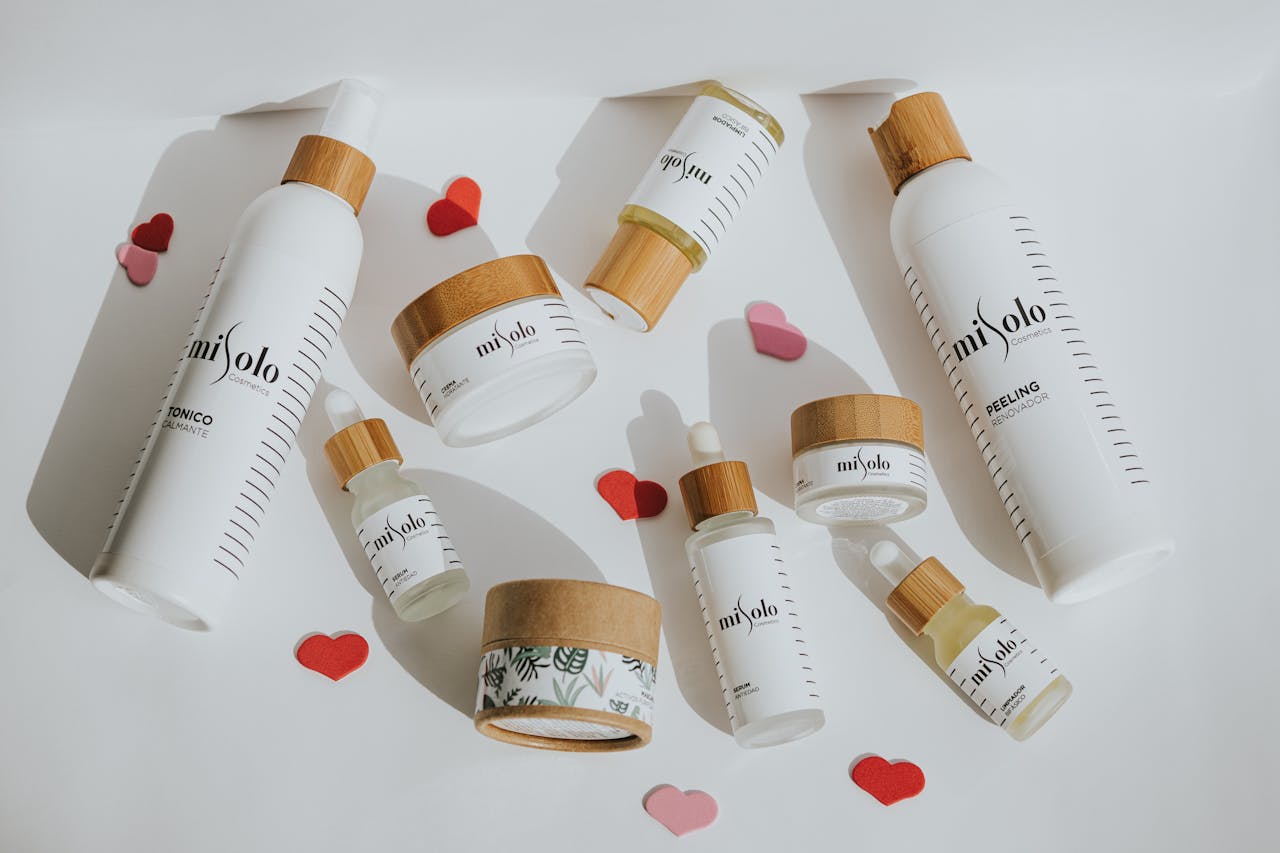 about-bg Flat lay of eco-friendly cosmetic products with playful heart accents.