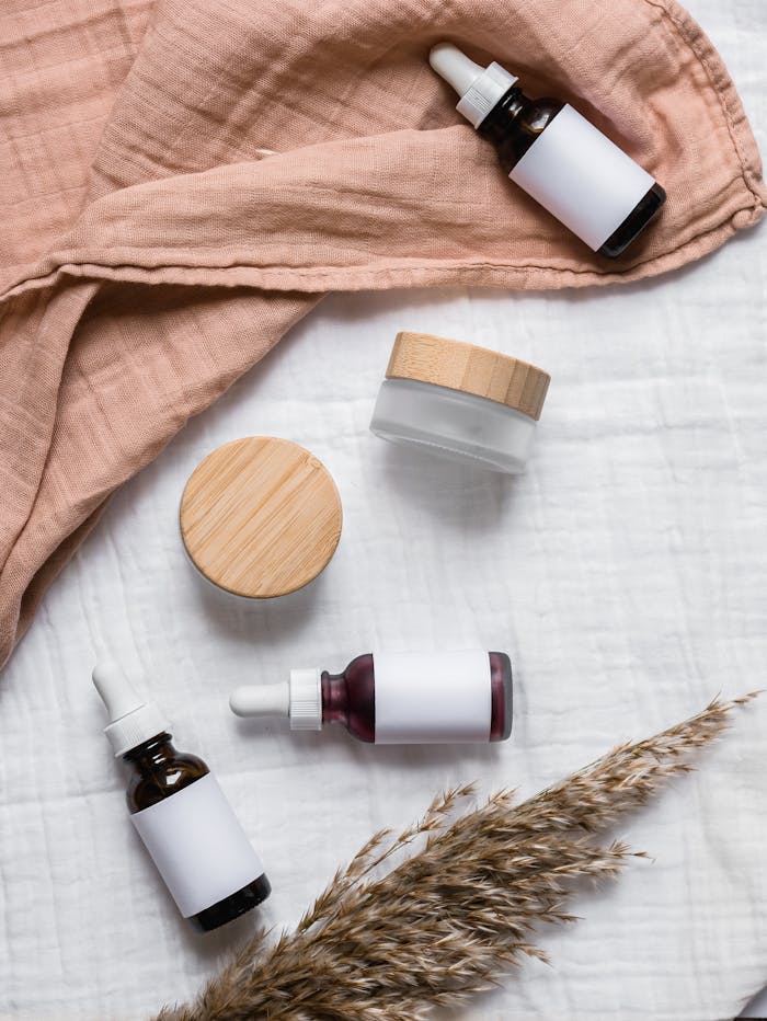 Crafting Captivating Headlines: Your awesome post title goes here Stylish flat lay of serum bottles and jars on soft fabric with a natural, earthy aesthetic.